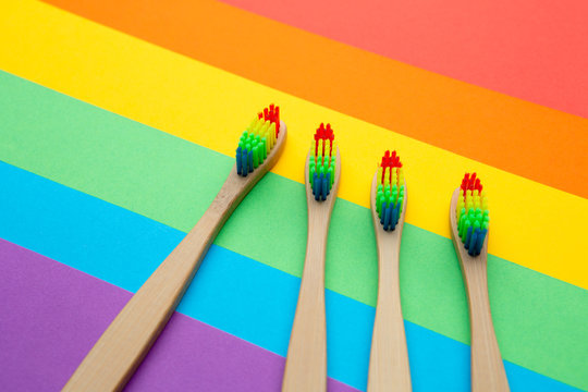 Image of four toothbrushes located in center.