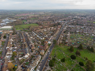 Fototapeta na wymiar Aerial photo of the town of Aylesbury in the UK showing roads, residential properties, rows of houses and businesses.