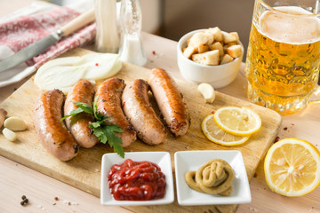 fried sausage, pork sausages, ketchup, mustard, beer, lemon