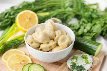 dumplings in a plate, greens,