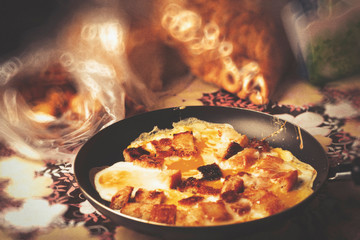 On the table is a freshly prepared breakfast. Morning food is good for human health. Charge of cheerfulness and strength for the whole day. Fried foods are a source of high cholesterol in human blood.