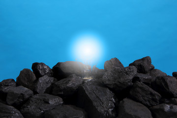 The bulb shines with strong light thanks to the electricity obtained from the hard coal heap.