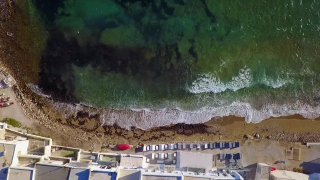 Aerial bird's eye view video taken by drone of iconic and picturesque port of Naousa village, Paros island, Cyclades, Greece
