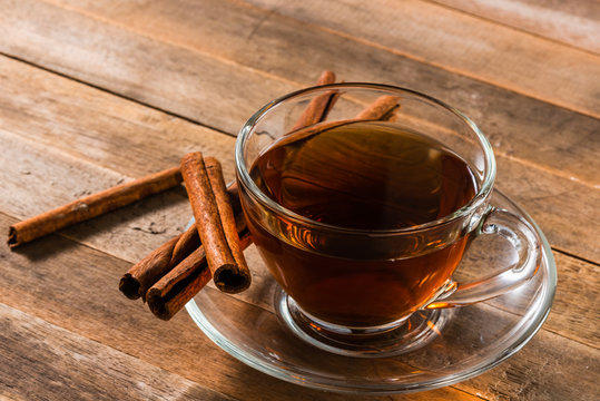 A Cup Of Cinnamon Tea On Wooden Table