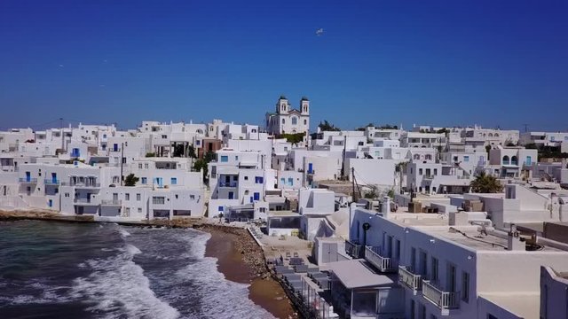 Aerial bird's eye view video taken by drone of iconic and picturesque port of Naousa village, Paros island, Cyclades, Greece