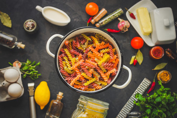 pasta, fusilli, italian food (multi-colored) set of ingredients. top .. food background copy space