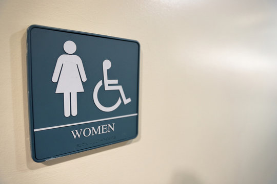 Women's bathroom sign with handicapped symbol and text space