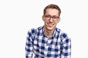 Smiling guy in glasses looking at camera