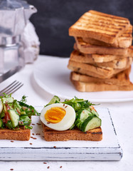 toasted square pieces of bread from white wheat flour with boiled egg
