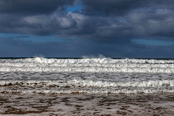 Storm clouds and waves at bells beach, great ocean road, australia
