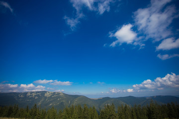 Blue sky background with tiny clouds in sunny day.