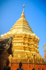 Beautiful northern Thai style architectural of golden church and pagoda at Wat Phra That Doi Suthep, the famous temple and became the landmark of Chiang Mai, Thailand.