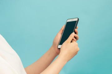 girl with smartphone and blue background for network concept