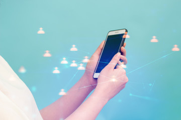 girl with smartphone and blue background for network concept