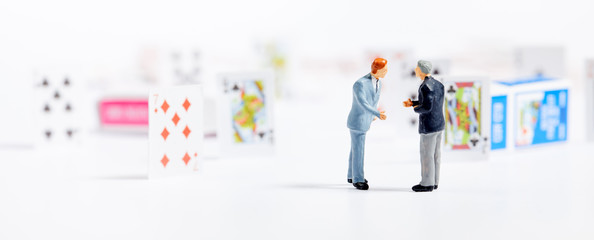 Miniature people : business man on Playing cards.