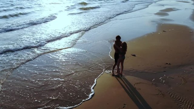couple in love on the sea at sunset.  top view 