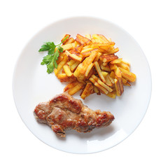 steak with fried potatoes isolated top view