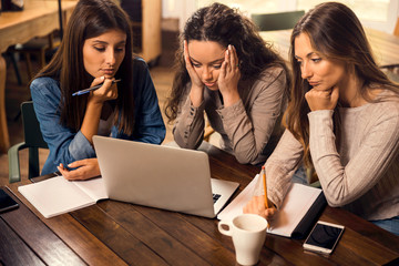 Female friends worried with final exams