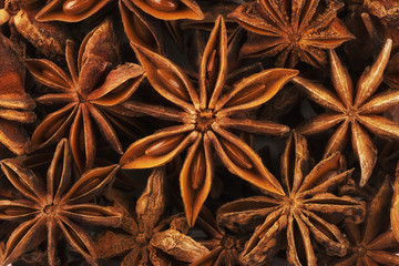 Extremely close up on a pile of anise stars. Shallow focus.