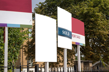 Blank for sale signs on display