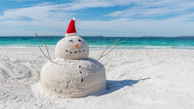 Time lapse video with sliding effect of Australian Christmas Sandman on a beautiful white sandy beach