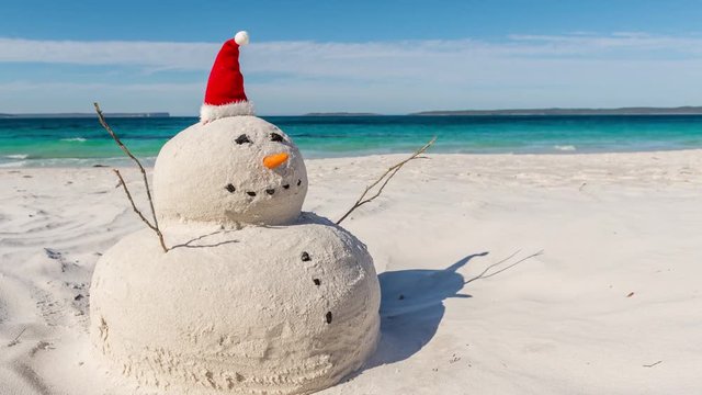 4K Time lapse video with sliding effect of Australian Christmas Sandman on a beautiful white sandy beach