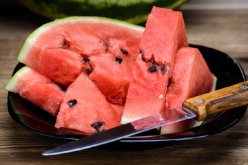 Watermelon cut into pieces on a plate