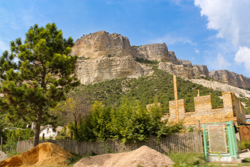 Fototapeta na wymiar Construction near the rocks.