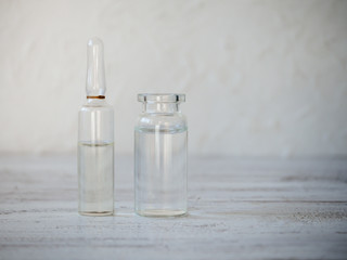 Glass ampoules with medication in the table