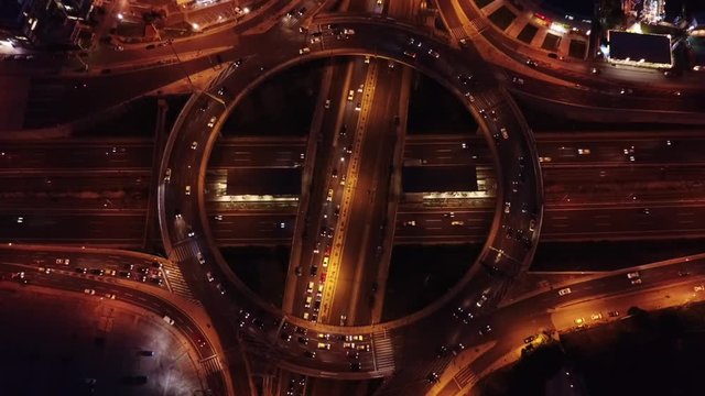 Aerial night video of ring road passing through city center