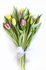 Spring big bouquet. Yellow and pink tulips. Spring card or background with space for text.  Top view. Copy space.  Mock-up