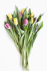 Spring big bouquet. Yellow and pink tulips. Spring card or background with space for text.  Top view. Copy space.  Mock-up