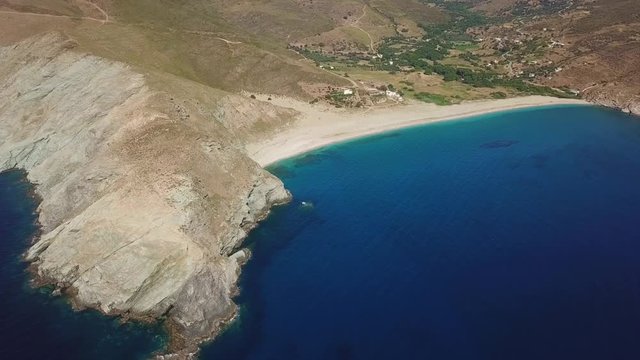 Aerial dorne bird's eye view video of iconic beach of Potami or River with turquoise clear waters, South Evia island, Greece