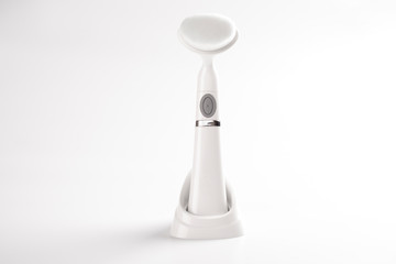 Brush device for cleaning the face of dirt, acne. Life hack for women. Item on white background