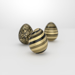 Three Easter egg concept with striped golden decoration