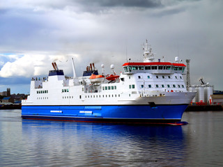 Fototapeta premium Passenger Cargo Ferry leaving harbou on passage to next port.