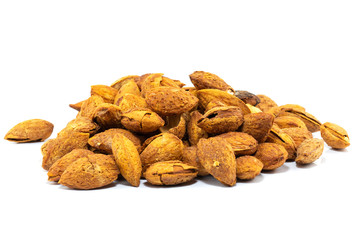 Group of roasted salty almonds in shell isolated on white background