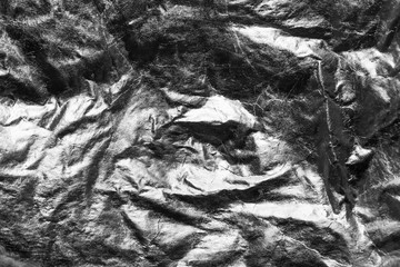 Silver crumpled reflective background, grunge style.