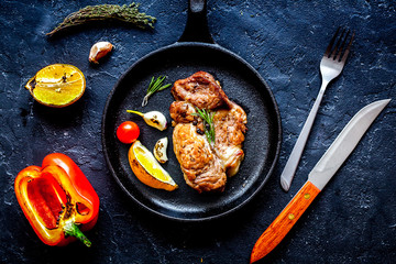 concept cooked steak on dark background top view
