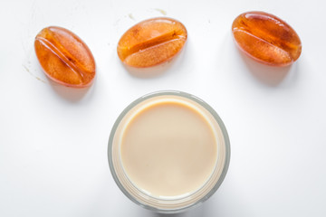coffee with ice in glass top view on white background