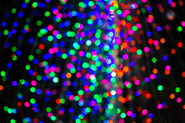 Beautiful bokeh blurred light from Christmas light bulbs background.