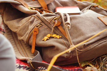 backpack traveler lies on the grass close-up. Stop to rest on the way.