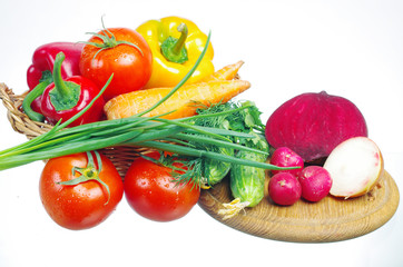 Appetizing vegetables. Tomatoes, cucumbers, onions, carrots, peppers, parsley.
