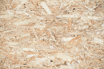 Pressed wooden panel background, seamless texture of oriented strand board - OSB
