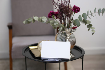 Small white box on a coffee table with flowers
