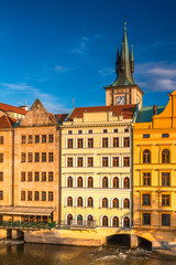 Historic buildings on the Vltava River in the Old Town of Prague at sunset, Czech Republic, Europe.