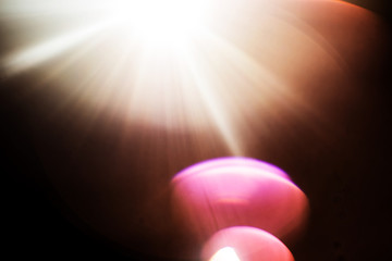 Lens Flare. Light over black background. Easy to add overlay or screen filter over photos. Abstract...