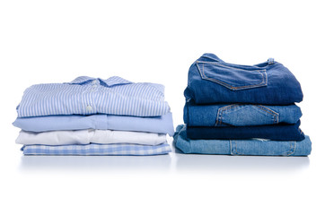 Stack blue shirt and jeans on white background isolation
