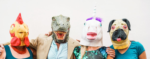 Fototapeta Happy family wearing different carnival masks - Crazy people having fun wearing on chicken, carlino, t-rex and unicorn mask - Concept of bizarre, humor and masquerade holidays lifestyle party obraz