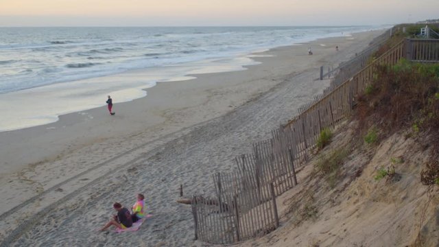 People on a Sandy Beach Shore in the Outer Banks